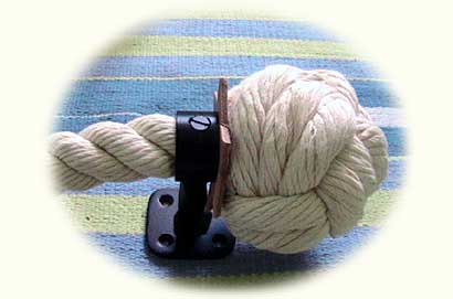 3 ply knot on cotton stair rope with single leather washer and wrought iron bracket