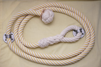 Stair rope in cotton wormed with yellow polypropylene cord, manrope knot and eyesplice with turks head whipping